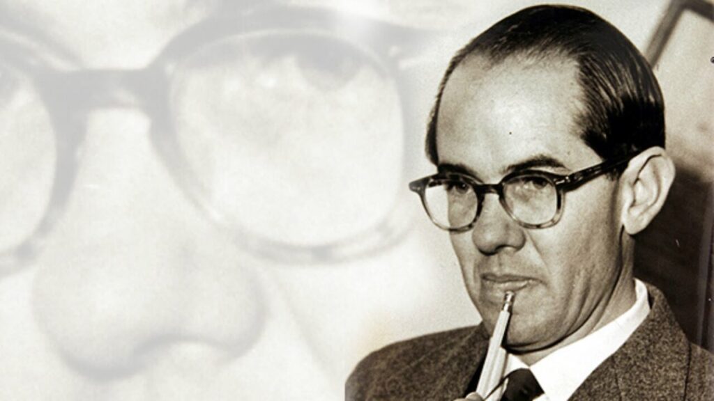 Retrato clásico de Alfonso López Michelsen con gafas de pasta gruesa y actitud pensativa, primer gobernador del Cesar y fundador del Festival Vallenato.