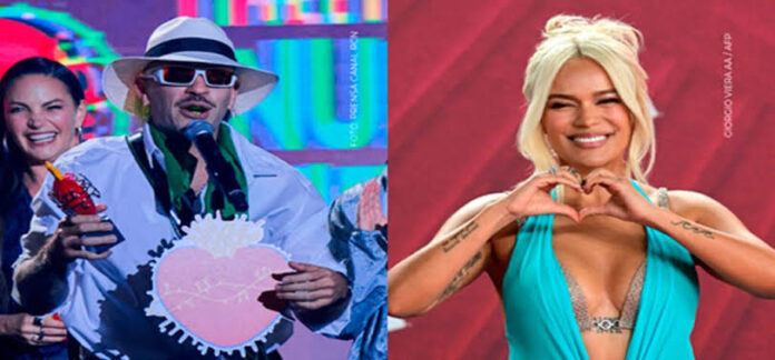 Feid agradece a Karol G durante los Premios Nuestra Tierra 2026 tras recibir reconocimiento en la ceremonia.