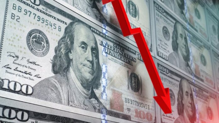 Gráfica financiera que ilustra la fuerte tendencia a la baja y la reducción en el precio del dólar en Colombia frente a la TRM.
